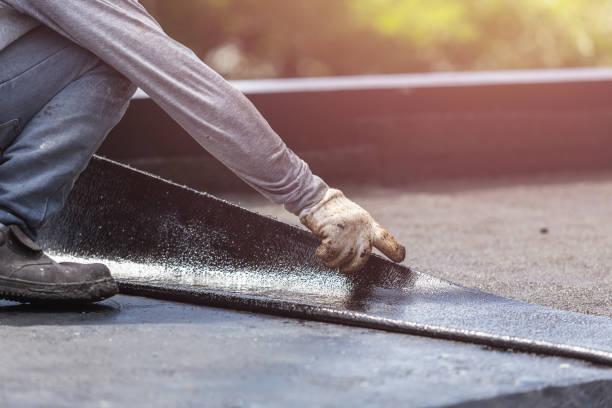 Professional Waterproofing technician working in Coopersville, MI